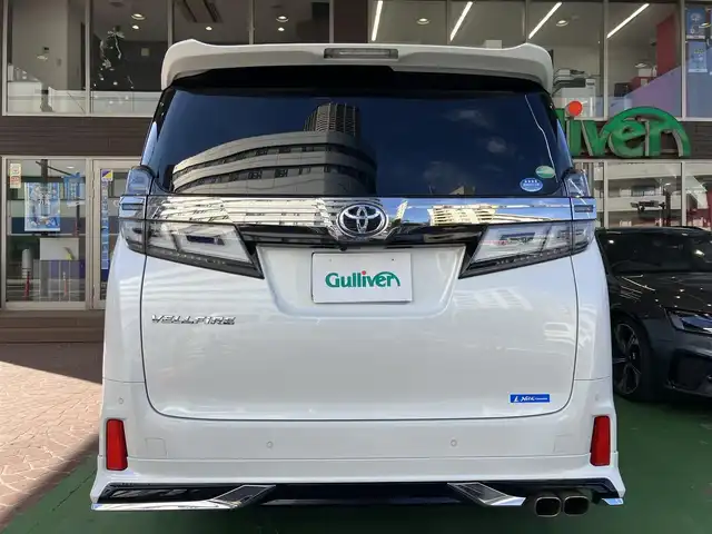 トヨタ ヴェルファイア Z Gエディション 神奈川県 2018(平30)年 7.7万km ホワイトパールクリスタルシャイン ワンオーナー/新車保証書/取扱説明書/レザーシート/サンルーフ/モデリスタエアロ/3眼LEDヘッドライト/トヨタセーフティセンス/・レーンレーシングアシスト/・クリアランスソナー/・プリクラッシュセーフティ/・ロードサインアシスト/・レーダークルーズコントロール（全車速追従機能付き）/・オートマチックハイビーム/純正ナビ・フルセグTV/CD・DVDビデオ・Bluetooth/HDMI・USB・SD/バックカメラ/デジタルインナーミラー/純正フリップダウンモニター/ビルトインETC2.0/前席パワーシート/前席快適温熱シート/助手席・後席電動オットマン/後席エグゼクティブパワーシート/両側パワースライドドア/パワーバックドア/ステアリングスイッチ/サンシェード/純正18インチアルミホイール/ドアバイザー/フロアーマット