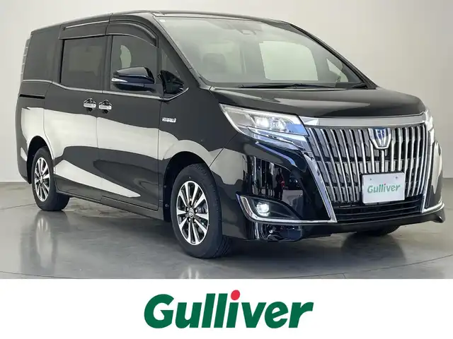 トヨタ エスクァイア ハイブリッド Gi 愛知県 2020(令2)年 2.4万km ブラック 純正９型ナビ　純正後席モニター　禁煙車　バックカメラ　ＥＴＣ　ハーフレザー　シートヒーター　クルコン　　前後ドラレコ　セーフティセンス　衝突軽減　コーナーセンサー　ＬＥＤライト　ＵＳＢ　両側パワスラ