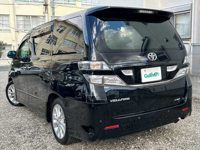 トヨタ ヴェルファイア 2．4Z プラチナセレクション 福岡県 2010(平22)年 14.3万km ブラック 純正ナビ/純正フロアマット/ETC（ビルド）/TV（ワンセグ）/AM/Bluetoothオーディオ/DVD／CD/SD/USB/HDMI/ハンズフリー/オートライト/電動リアゲート/パワースライドドア（左右）/フリップダウンモニター/プッシュスタート/パーキングセンサー/横滑り防止/温度調節付きドリンクホルダー/オットマン/ワンオーナー/フォグランプ