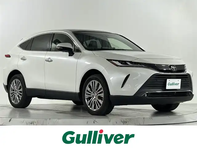 トヨタ ハリアー Z 佐賀県 2021(令3)年 2.7万km ホワイトパールクリスタルシャイン 純正12.3インチディスプレイオーディオ/フルセグTV/Bluetooth/Androidauto/Applecarplay/JBLサウンド/パノラマガラスルーフ/バックカメラ/デジタルインナールームミラー/衝突被害軽減システム/ブラインドスポットモニター/ヘッドアップディスプレイ/レーダークルーズコントロール/レーンアシスト/パーキングサポートブレーキ/ロードサインアシスト/クリアランスソナー/オートライト/オートマチックハイビーム/LEDヘッドライト/LEDフォグライト/電子パーキング/ブレーキホールド/ビルトインETC2.0/運転席パワーシート/ハーフレザシート/パワーバックドア/純正19インチアルミホイール/純正フロアマット/ISOFIX対応/スマートキー/スペアキー×１