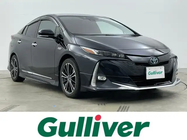 トヨタ プリウス ＰＨＶ A 岡山県 2019(令1)年 6.8万km アティチュードブラックマイカ モデリスタエアロ（F・S・R）/セーフティセンス/ディーラーオプションナビ（NSZT-Y68T）/フルセグTV/Bluetooth/パノラミックビューモニター/革調シートカバー/レーダークルーズ/シートヒーター（運転席・助手席）/パワーシート（運転席）/パーキングサポート/ブラインドスポットモニタリング/LEDオートライト/USB端子・HDMI端子/ビルトインETC/トヨタ純正ホイール
