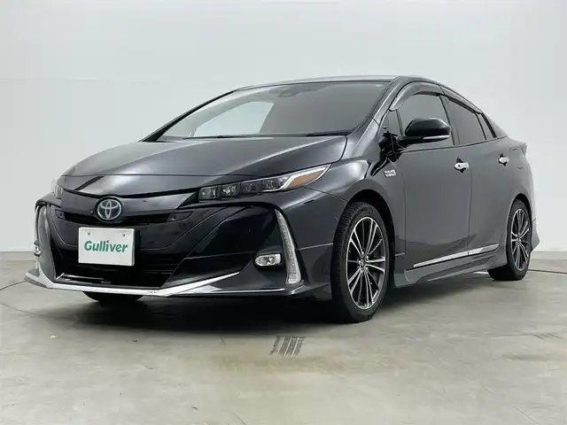 トヨタ プリウス ＰＨＶ A 岡山県 2019(令1)年 6.8万km アティチュードブラックマイカ モデリスタエアロ（F・S・R）/セーフティセンス/ディーラーオプションナビ（NSZT-Y68T）/フルセグTV/Bluetooth/パノラミックビューモニター/革調シートカバー/レーダークルーズ/シートヒーター（運転席・助手席）/パワーシート（運転席）/パーキングサポート/ブラインドスポットモニタリング/LEDオートライト/USB端子・HDMI端子/ビルトインETC/トヨタ純正ホイール