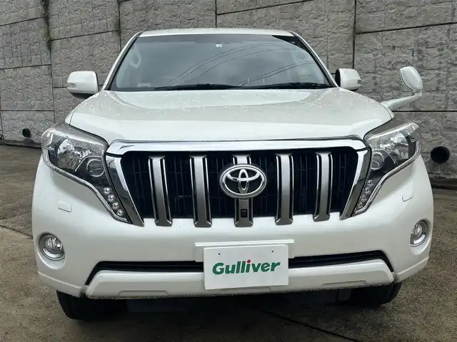 トヨタ ランドクルーザー プラド TX Lパッケージ 長崎県 2014(平26)年 13.1万km ホワイトパールクリスタルシャイン 11型フローティングナビ/(CD/DVD/BT/フルセグ)/バックカメラ/クルーズコントロール/ビルトインETC/黒レザーシート/パワーシート/シートヒーター/スマートキー/プッシュスタート/ドライブレコーダー/社外17インチAW/オートライト/フォグランプ