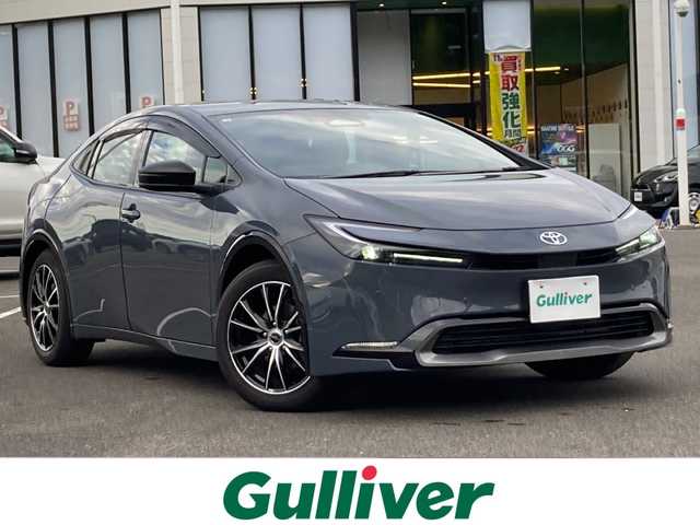 トヨタ プリウス Z 佐賀県 2025(令7)年 0.9万km グレー ワンオーナー/純正12.3インチディスプレイオーディオ/パノラマミックビューモニター/プリクラッシュセーフティ/レーンディパーチャーアラート/オートハイビーム/アダプティブクルーズコントロール/クリアランスソナー/ブラインドスポットモニター/リアクロストラフィックアラート/電動パーキングブレーキ/オートブレーキホールド/パーキングアシスト/デジタルインナーミラー/置くだけ充電/レザーシート/パワーシート/シートヒーター/エアシート/ステアリングヒーター/ステアリングリモコン/パワートランク/ETC2.0/プッシュスタート/スマートキー/LEDヘッドライト/社外アルミホイール/アッシュグレー（1M2)