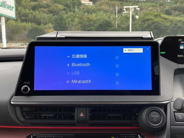 トヨタ プリウス Z 佐賀県 2025(令7)年 0.9万km グレー ワンオーナー/純正12.3インチディスプレイオーディオ/パノラマミックビューモニター/プリクラッシュセーフティ/レーンディパーチャーアラート/オートハイビーム/アダプティブクルーズコントロール/クリアランスソナー/ブラインドスポットモニター/リアクロストラフィックアラート/電動パーキングブレーキ/オートブレーキホールド/パーキングアシスト/デジタルインナーミラー/置くだけ充電/レザーシート/パワーシート/シートヒーター/エアシート/ステアリングヒーター/ステアリングリモコン/パワートランク/ETC2.0/プッシュスタート/スマートキー/LEDヘッドライト/社外アルミホイール/アッシュグレー（1M2)