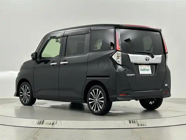 トヨタ ルーミー カスタムG－T 埼玉県 2023(令5)年 0.4万km ブラックマイカメタリック 純正9インチナビ　NSZT-Y68T/(Bluetooth/CD/DVD/AM/FM)/地デジフルセグ/バックカメラ/前後ドライブレコーダー/ETC2.0/アダプティブクルーズコントロール/クリアランスソナー/前席シートヒーター/衝突軽減ブレーキ/アイドリングストップ/電子パーキングシステム/ブレーキホールド/両側パワースライドドア/プッシュスタート/ステアリングリモコン/ウィンカーミラー/フロントフォグランプ/ロールサンシェード/純正フロアマット/純正ドアバイザー/純正15インチアルミホイール