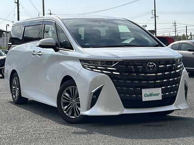 トヨタ アルファードハイブリット Z 愛知県 2023(令5)年 1.8万km プラチナホワイトパールマイカ 登録時走行距離17947キロ/ワンオーナー/純正ナビゲーション/(BT/フルセグTV/)/バックカメラ/全方位モニター/前後ドライブレコーダー/トヨタセーフティー/プリクラッシュセーフティー/レーンディパーチャーアラート/先行車発進告知/ロードサインアシスト/レーダークルーズコントロール/純正デジタルインナーミラー/リヤカメラディテクション/プロアクティブドライビングアシスト/リヤクロストラフィックアラート/ブラインドスポットモニター/パーキングサポートブレーキ/カラーヘッドアップディスプレイ/後席パワーサイドサンシェード/純正ビルドイン2.0ETC/左右独立ムーンルーフ/オットマン/両側パワースライドドア/パワーシート/パワーバックドア/シートヒーター/エアシート/ステアリングヒーター/純正ドアバイザー/純正フロアマット/プッシュスタート/ウィンカーミラー/スペアキー×１/取扱説明書/保証書/整備記録簿