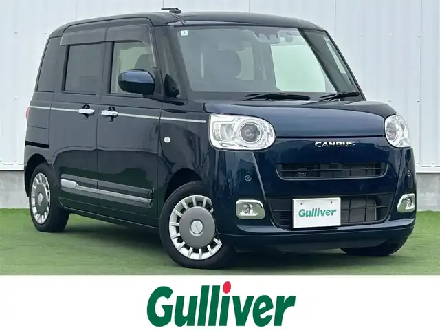 ダイハツ ムーヴ キャンバス セオリー G 香川県 2024(令6)年 0.7万km レーザーブルークリスタルシャイン 社外7インチSDナビ/→フルセグ/CD/DVD/Bluetooth/バックカメラ/スマートアシスト/・衝突警報/衝突回避支援ブレーキ/・ブレーキ制御付誤発進抑制機能/・車線逸脱警報/抑制機能/・ふらつき警報/・路側逸脱警報機能/・アダプティブドライビングビーム/・オートハイビーム/両側パワースライドドア/前席シートヒーター/LEDヘッドライト/LEDフォグランプ/電子パーキングブレーキ/オートブレーキホールド/ホッとカップホルダー/置きラクボックス/本革ステアリング/ステアリングリモコン/アイドリングストップ/プッシュスタート/スマートキー