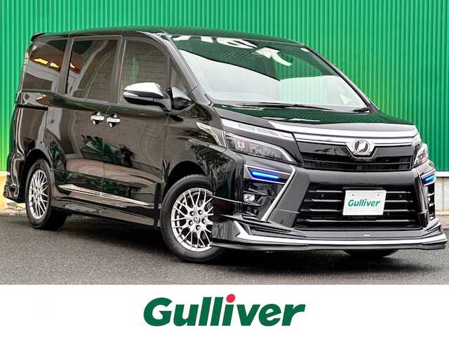 トヨタ ヴォクシー ハイブリッド ZS 煌Ⅲ 宮城県 2020(令2)年 5.8万km ブラック モデリスタエアロ（F/S/R）/マフラーカッター/セーフティセンス/・プリクラッシュセーフティ/・レーンディパーチャーアラート/・オートマチックハイビーム/・先行車発進告知機能/インテリジェントクリアランスソナー/純正10インチナビ（NSZN-Z68T）/・CD/DVD/・Bluetooth/・フルセグTV/・SD音楽録音機能/バックカメラ/ビルトインETC/ドライブレコーダー/両側パワースライドドア/ハーフレザーシート/シートヒーター/革巻きステアリング/クルーズコントロール/ステアリングスイッチ/LEDヘッドライト/フォグランプ/オートライト/スマートキー＆プッシュスタート/電動格納ミラー/純正16インチAW/フロアマット/Wエアバッグ