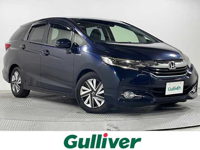 ホンダ シャトル ハイブリッド X 広島県 2016(平28)年 5.8万km ミッドナイトブルービームM 純正ナビ　/バックカメラ　/フルセグ　/レーダークルーズコントロール　/オートライト　/衝突軽減ブレーキ　/ＬＥＤヘッドランプ　/スマートキー　/ハーフレザーシート　/フォグランプ　/純正フロアマット　/横滑り防止　/ETC/純正15インチアルミキャップ（185/60/R15)/エアバック（運転席/助手席/サイド）