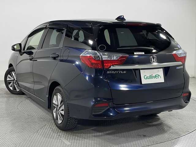 ホンダ シャトル ハイブリッド X 広島県 2016(平28)年 5.8万km ミッドナイトブルービームM 純正ナビ　/バックカメラ　/フルセグ　/レーダークルーズコントロール　/オートライト　/衝突軽減ブレーキ　/ＬＥＤヘッドランプ　/スマートキー　/ハーフレザーシート　/フォグランプ　/純正フロアマット　/横滑り防止　/ETC/純正15インチアルミキャップ（185/60/R15)/エアバック（運転席/助手席/サイド）