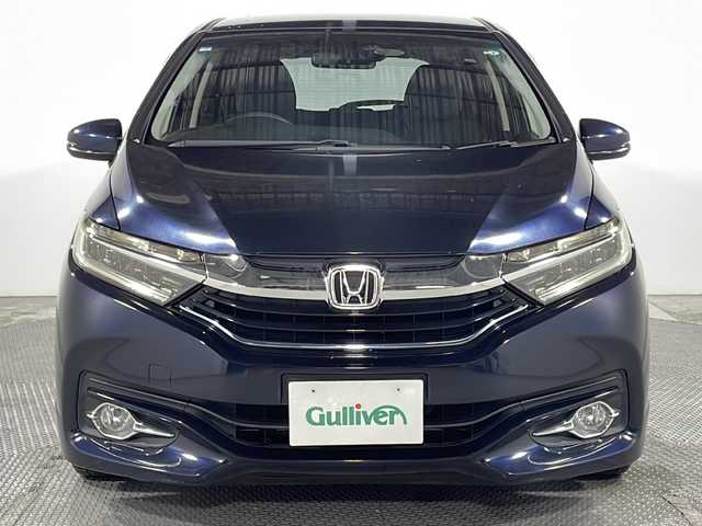 ホンダ シャトル ハイブリッド X 広島県 2016(平28)年 5.8万km ミッドナイトブルービームM 純正ナビ　/バックカメラ　/フルセグ　/レーダークルーズコントロール　/オートライト　/衝突軽減ブレーキ　/ＬＥＤヘッドランプ　/スマートキー　/ハーフレザーシート　/フォグランプ　/純正フロアマット　/横滑り防止　/ETC/純正15インチアルミキャップ（185/60/R15)/エアバック（運転席/助手席/サイド）