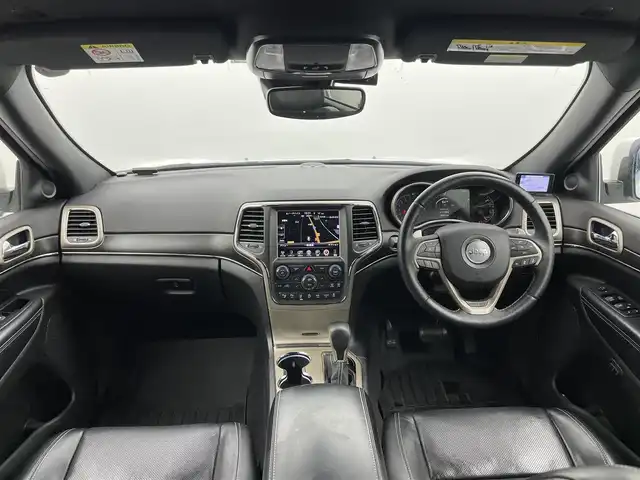 クライスラー・ジープ ジープ グランドチェロキー LTD 富山県 2018(平30)年 8.4万km パール 4WD/純正ナビ（AM/FM/CD/DVD/AUX/USB/SD/BT）/フルセグTV/バックカメラ/アダプティブパークセンス/パークセンス/パークアシスト/アダプティブクルーズコントロール/ブラインドスポットモニター/ヒルスタートアシスト/コーナーセンサー前後/ドライブレコーダー前後/ETC/レーダー探知機/パドルシフト/レザーシート/D席メモリ付きシート/前席パワーシート/全席シートヒーター/ステアリングヒーター/サイドミラーヒーター/社外18インチAW/HIDヘッドライト/オートライト/プッシュスタート/アイドリングストップ