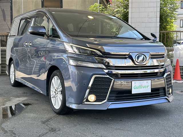 トヨタ ヴェルファイア Z Aエディション 京都府 2016(平28)年 7.2万km グレイッシュブルーマイカメタリック 純正SDナビ /（NSZT-Y64T)/フルセグTV/Bluetooth/CD再生機能/USB/両側パワースライドドア /純正11型フリップダウンモニター/オットマン/2列目ウォークスルー/衝突軽減　/Wサイドエアバッグ/カーテンエアバッグ/全方位カメラ　/禁煙車　/前後コーナーセンサー　/横滑り防止/盗難防止装置/LEDヘッドライト/フロントフォグランプ　/オートライト/クルコン追従有　/スマートキー　/前方ドラレコ　/純正AW18インチ