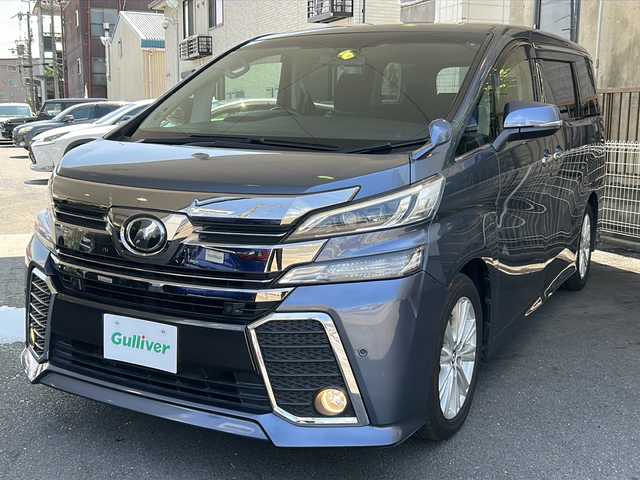 トヨタ ヴェルファイア Z Aエディション 京都府 2016(平28)年 7.2万km グレイッシュブルーマイカメタリック 純正SDナビ /（NSZT-Y64T)/フルセグTV/Bluetooth/CD再生機能/USB/両側パワースライドドア /純正11型フリップダウンモニター/オットマン/2列目ウォークスルー/衝突軽減　/Wサイドエアバッグ/カーテンエアバッグ/全方位カメラ　/禁煙車　/前後コーナーセンサー　/横滑り防止/盗難防止装置/LEDヘッドライト/フロントフォグランプ　/オートライト/クルコン追従有　/スマートキー　/前方ドラレコ　/純正AW18インチ