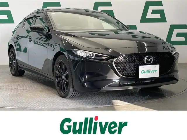 マツダ マツダ３ファストバック 15S 鹿児島県 2025(令7)年 0.5万km ジェットブラックマイカ 15S ブラックセレクション/禁煙/純正ナビ/バックカメラ/スマートブレーキサポート/レーンキープアシスト/誤発進抑制機能/追従型クルーズコントロール/ブラインドスポットモニター/ヘッドアップディスプレイ/運転席メモリー機能付きパワーシート/前席シートヒーター/前後コーナーセンサー/純正フロアマット/純正アルミホイール