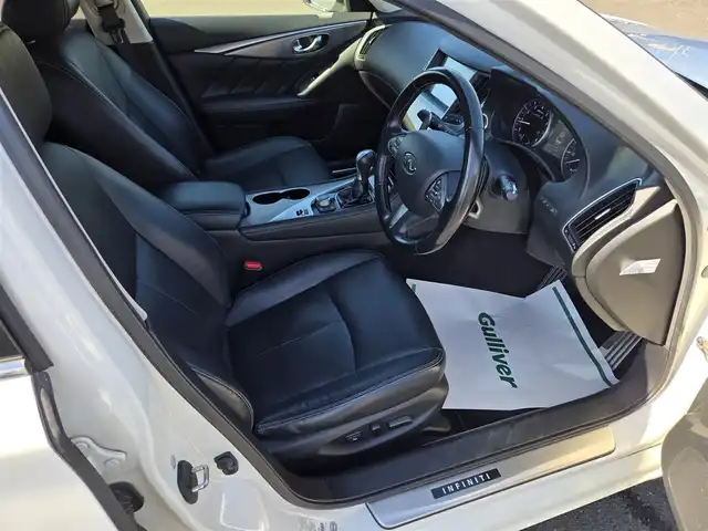 日産 スカイライン 200GT－t タイプSP 鹿児島県 2015(平27)年 6.7万km クリスタルホワイトパール インフィニティＱ６０用純正２０インチアルミホイール　/ムーンルーフ　/社外レーダー　/Ｄ＋Ｎ席シートヒーター　/Ｄ＋Ｎ席パワーシート　/ＮｉｓｓａｎＣｏｎｎｅｃｔ　/アラウンドビューモニター/インテリジェントクルーズコントロール/前後純正エアロスプラッシュ/シートメモリー/Bluetoothオーディオ/ビルトインETC/フルセグテレビ/パドルシフト/ＭＴモード付きＡＴ/横滑り防止装置/レーンキープアシスト/プッシュスタート/スマートキー/エアバック(W+サイド)/カーテンエアバッグ