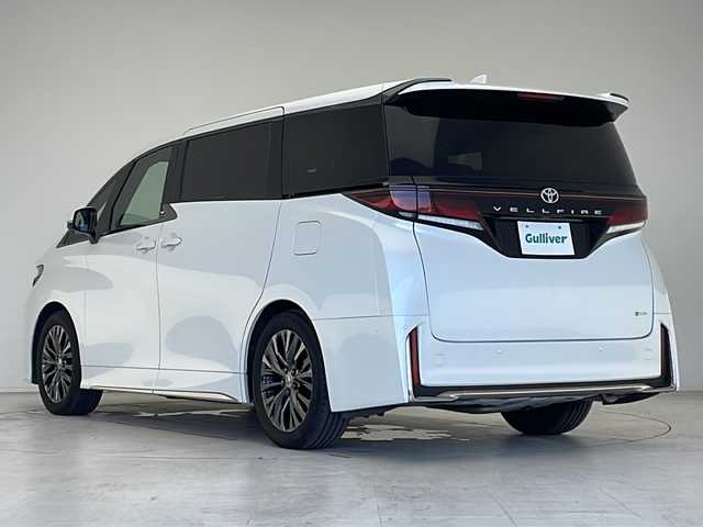トヨタ ヴェルファイア ハイブリット Z プレミア 愛知県 2024(令6)年 2.1万km プラチナホワイトパールマイカ 衝突軽減システム/純正14型ディズプレイオーディオ　ナビあり/フリップダウンモニター/三眼LEDヘッドライト/全方位カメラ/両側パワースライドドア/ユニバーサルステップ/ガラスルーフ/レーダークルーズコントロール/シートヒーター/エアシート/フルセグ/Bluetooth/バックカメラ/電動リアゲート/パワーシート/ヘッドアップディスプレイ/コーナーセンサー/純正アルミホイール/ETC2.0/ブラインドスポットモニター/パドルシフト/ステアリングヒーター/インテリジェントミラー/リアオートエアコン/オートマチックハイビーム/置くだけ充電機/ステアリングスイッチ/スマートキー/プッシュスタート