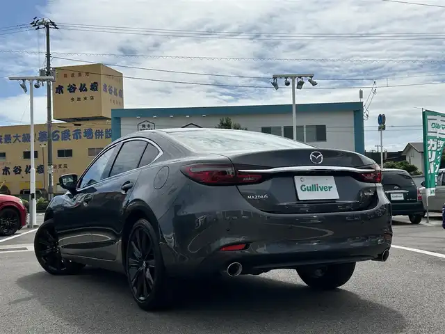 マツダ マツダ６セダン XD ブラックトーンエディション 愛媛県 2022(令4)年 2.1万km マシーングレープレミアムM 登録時走行距離：20955km/BOSEスピーカー/パドルシフト/革シート/メーカーOP純正ナビ/AM/FM/フルセグTV/DVD/CD/前後ドラレコ/ETC2.0/全周囲カメラ/追従クルコン/レーンキープアシスト/パーキングアシスト/衝突軽減システム/横滑り防止装置/電動リアゲート/LEDヘッドライト/オートライト/エンジンスタートボタン/スマートキー/純正アルミホイール/純正フロアマット