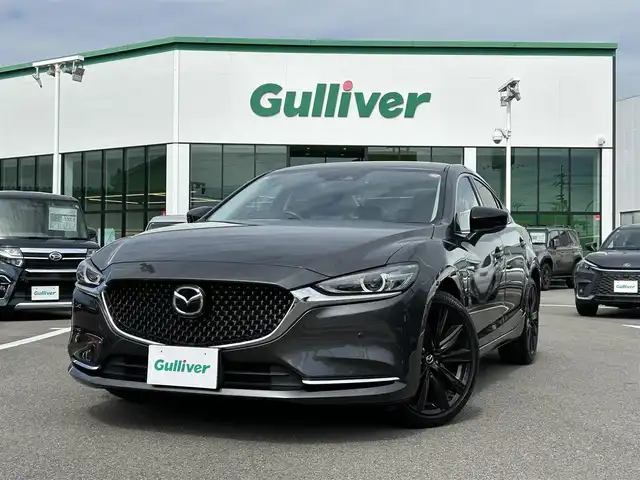 マツダ マツダ６セダン XD ブラックトーンエディション 愛媛県 2022(令4)年 2.1万km マシーングレープレミアムM 登録時走行距離：20955km/BOSEスピーカー/パドルシフト/革シート/メーカーOP純正ナビ/AM/FM/フルセグTV/DVD/CD/前後ドラレコ/ETC2.0/全周囲カメラ/追従クルコン/レーンキープアシスト/パーキングアシスト/衝突軽減システム/横滑り防止装置/電動リアゲート/LEDヘッドライト/オートライト/エンジンスタートボタン/スマートキー/純正アルミホイール/純正フロアマット