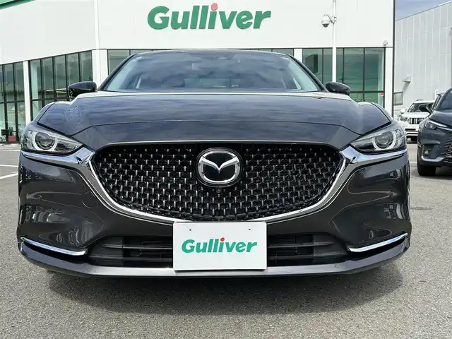 マツダ マツダ６セダン XD ブラックトーンエディション 愛媛県 2022(令4)年 2.1万km マシーングレープレミアムM 登録時走行距離：20955km/BOSEスピーカー/パドルシフト/革シート/メーカーOP純正ナビ/AM/FM/フルセグTV/DVD/CD/前後ドラレコ/ETC2.0/全周囲カメラ/追従クルコン/レーンキープアシスト/パーキングアシスト/衝突軽減システム/横滑り防止装置/電動リアゲート/LEDヘッドライト/オートライト/エンジンスタートボタン/スマートキー/純正アルミホイール/純正フロアマット