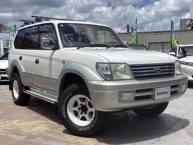 トヨタ ランドクルーザー プラド TX－LTD ワイド 京都府 2001(平13)年 17.8万km ホワイト/シルバーM ワンオーナー/3.0Ｌディーゼルターボ４ＷＤ/電動サンルーフ/ルーフレール/寒冷地仕様/　 ２バッテリー/リアヒーター/社外ルーフキャリア/背面タイヤ/ＲＡＹＳ16インチアルミ/社外メモリーナビ/　 CD DVD BT SD フルセグＴＶ/ETC/サイドステップ/社外ＬＥＤヘッドライト/社外ＬＥＤフォグ/キーレスエントリー/アクティブＴＲＣ/マルチインフォメーション/アイドルＵＰ/スペアキー/新車保証書/取扱説明書