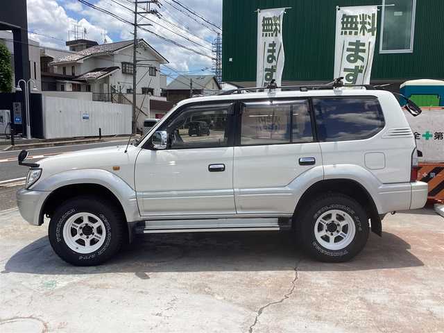 トヨタ ランドクルーザー プラド TX－LTD ワイド 京都府 2001(平13)年 17.8万km ホワイト/シルバーM ワンオーナー/3.0Ｌディーゼルターボ４ＷＤ/電動サンルーフ/ルーフレール/寒冷地仕様/　 ２バッテリー/リアヒーター/社外ルーフキャリア/背面タイヤ/ＲＡＹＳ16インチアルミ/社外メモリーナビ/　 CD DVD BT SD フルセグＴＶ/ETC/サイドステップ/社外ＬＥＤヘッドライト/社外ＬＥＤフォグ/キーレスエントリー/アクティブＴＲＣ/マルチインフォメーション/アイドルＵＰ/スペアキー/新車保証書/取扱説明書