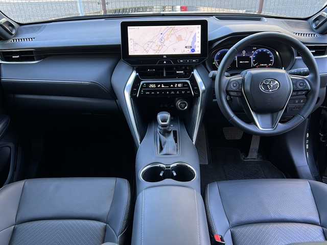 トヨタ ハリアー ハイブリッド Z レザーパッケージ 広島県 2024(令6)年 1.1万km プレシャスブラックパール 後期型/禁煙車/モデリスタエアロ（F/S/R）/モデリスタシグネチャーイルミグリル/トヨタセーフティセンス/・プリクラッシュセーフティ/・レーンディパーチャーアラート/・LTA/・先行車発進告知/・RSA/・レーダークルーズコントロール/クリアランスソナー/HUD/BSM/デジタルインナーミラー/JBLプレミアムサウンド/純正12.3インチナビ/・フルセグ/Bluetooth/USB/パノラミックビューモニター/ステアリングヒーター/革巻きステアリング/ステアリングスイッチ/黒革シート/シートヒーター/ベンチレーション/パワーシート/シートメモリー/LEDヘッドライト/ETC2.0/AC100V1500W電源（トランク）/純正ドアバイザー/純正フロアマット/純正19インチアルミホイール/W+サイド+カーテンエアバック