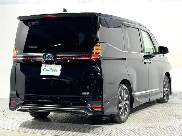 トヨタ ヴォクシー ハイブリッド S－Z 大阪府 2023(令5)年 3.2万km アティチュードブラックマイカ モデリスタエアロ 純正10.5incナビTV バックカメラ フリップダウンモニター シートヒーター レーダークルコン 衝突軽減ブレーキ レーンアシスト オートハイビーム 両側パワースライドドア 100V電源 ETC