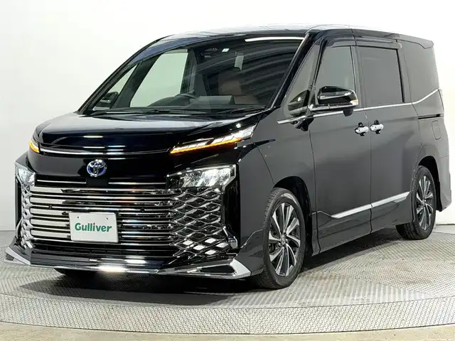 トヨタ ヴォクシー ハイブリッド S－Z 大阪府 2023(令5)年 3.2万km アティチュードブラックマイカ モデリスタエアロ 純正10.5incナビTV バックカメラ フリップダウンモニター シートヒーター レーダークルコン 衝突軽減ブレーキ レーンアシスト オートハイビーム 両側パワースライドドア 100V電源 ETC