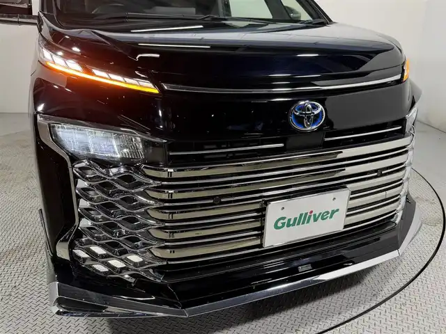 トヨタ ヴォクシー ハイブリッド S－Z 大阪府 2023(令5)年 3.2万km アティチュードブラックマイカ モデリスタエアロ 純正10.5incナビTV バックカメラ フリップダウンモニター シートヒーター レーダークルコン 衝突軽減ブレーキ レーンアシスト オートハイビーム 両側パワースライドドア 100V電源 ETC