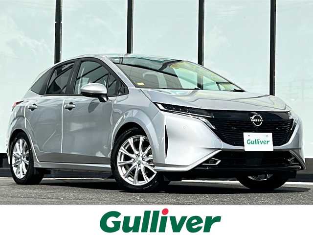日産 オーラ G FOUR 山形県 2023(令5)年 0.3万km ブリリアントシルバー ４WD/社外ナビ/Bluetooth/フルセグTV/インテリジェントアラウンドビューモニター/インテリジェント エマージェンシーブレーキ/踏み間違い衝突防止アシスト/車線逸脱警報/ふらつき警報/フロント&バックソナー/後側方衝突防止支援システム/後退時車両検知警報/横滑り防止装置/ドライブモードセレクター/ECOモード/EVモード/前席シートヒーター/ステアリングヒーター/ステアリングスイッチ/革巻きステアリング/ハーフレザーシート/ビルトインETC/純正フロアマット/プッシュスタート/LEDヘッドライト/オートライト/フォグランプ/オートマチックハイビーム/スマートキー/スペアキー