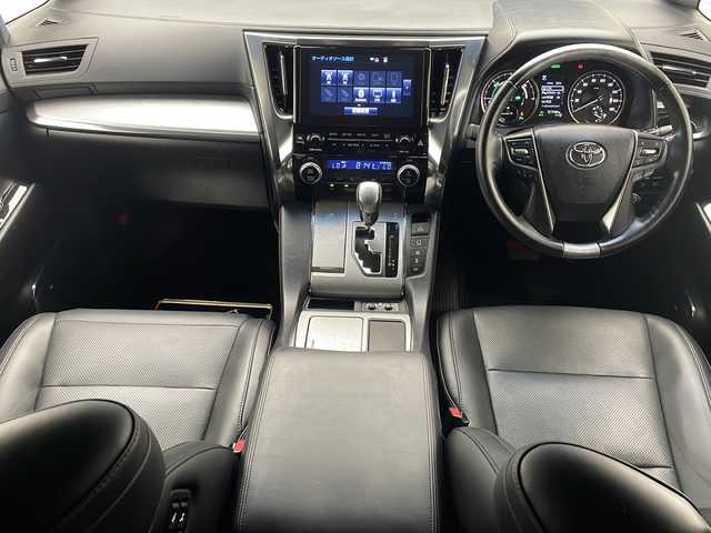 トヨタ アルファードハイブリット エグゼクティブ ラウンジ S 沖縄県 2019(令1)年 5.2万km ブラック 純正10.5型ナビ＋JBLサウンドシステム/　Blu-ray/CD/DVD/SD/USB/BT/フルセグ/パノラミックビューモニター/純正13.3型フリップダウンモニター/デジタルインナーミラー/ビルトインETC2.0 /純正ドライブレコーダー（DRT-H68A）/両側パワースライドドア　/パワーバックドア/トヨタセーフティセンス/ブラインドスポットモニター/リヤクロストラフィックオートブレーキ/インテリジェントクリアランスソナー/本革シート/1・2列目パワーシート/1・2列目シートエアコン・シートヒーター/ステアリングヒーター/純正17インチAW/スペアタイヤ（MOP）/純正フロアマット/プッシュスタート/スマートキ―/スペアキー/保証書・取扱説明書