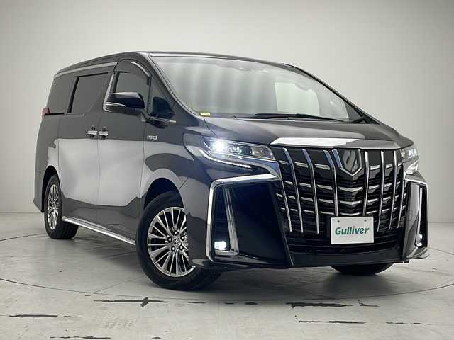 トヨタ アルファードハイブリット エグゼクティブ ラウンジ S 沖縄県 2019(令1)年 5.2万km ブラック 純正10.5型ナビ＋JBLサウンドシステム/　Blu-ray/CD/DVD/SD/USB/BT/フルセグ/パノラミックビューモニター/純正13.3型フリップダウンモニター/デジタルインナーミラー/ビルトインETC2.0 /純正ドライブレコーダー（DRT-H68A）/両側パワースライドドア　/パワーバックドア/トヨタセーフティセンス/ブラインドスポットモニター/リヤクロストラフィックオートブレーキ/インテリジェントクリアランスソナー/本革シート/1・2列目パワーシート/1・2列目シートエアコン・シートヒーター/ステアリングヒーター/純正17インチAW/スペアタイヤ（MOP）/純正フロアマット/プッシュスタート/スマートキ―/スペアキー/保証書・取扱説明書