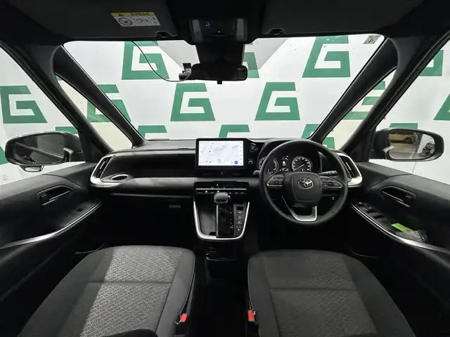 トヨタ ヴォクシー S－G 鹿児島県 2024(令6)年 1.3万km アティチュードブラックマイカ 禁煙車/ディスプレイオーディオ/(フルセグTV/HDMI/Bluetooth/AppleCarPlay/AndroidAuto/DVD/CD)/バックカメラ/Toyota Safety Sense/　・プリクラッシュセーフティ/　・レーントレーシングアシスト/　・レーンディパーチャーアラート/　・レーダークルーズコントロール/　・アダプティブハイビームシステム／オートマチックハイビーム/　・ロードサインアシスト/片側パワースライドドア/純正アルミホイール/フロアマット/電動格納ミラー