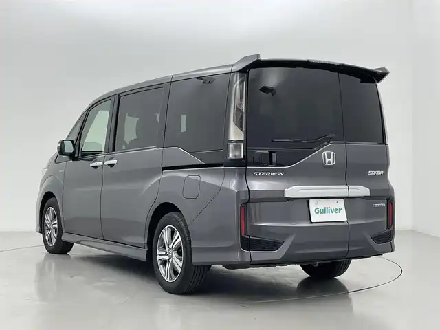 ホンダ ステップワゴン スパーダ ハイブリッド G EX ホンダセンシング 熊本県 2018(平30)年 6.7万km モダンスティールM 純正９インチナビVXM-187VFNi（ＣＤ・ＤＶＤ・フルセグ・ＢＴ・ＳＤ・ＵＳＢ）/バックカメラ　/社外前方ドライブレコーダー　/ビルトインＥＴＣ　/両側パワースライドドア　/前席シートヒーター　/ホンダセンシング/・衝突軽減ブレーキ/・アダブティブクルーズコントロール/・オートハイビーム/・先行車発進お知らせ機能/・路外逸脱制御/・レーンキープアシスト/・標識認識機能/横滑り防止/電動パーキング/ブレーキホールド/ハーフレザーシート/純正フロアマット/純正16インチAW/オートライト/LEDヘッドライト/フォグランプ/スマートキー/プッシュスタート/保証書