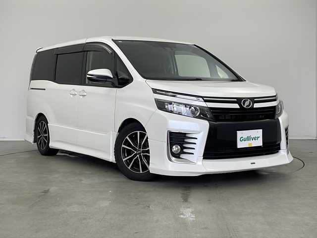 トヨタ ヴォクシー ZS 新潟県 2017(平29)年 8.9万km ホワイトパールクリスタルシャイン ナビ/（CD/DVD/SD/Bluetooth/HDMI/USB/フルセグテレビ）/バックカメラ/革調シートカバー/ハンドルカバー/ステアリングスイッチ/両側パワースライドドア/プッシュスタート/スマートキー/クルーズコントロール/オートライト/LEDライト/モデリスタエアロ/取扱説明書/保証書