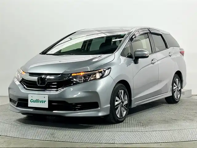 ホンダ シャトル ハイブリッド ホンダセンシング 大阪府 2020(令2)年 2.8万km ルナシルバーM 社外ナビ　衝突軽減ブレーキ　レーンアシスト　レーダークルーズコントロール　スマートキー　プッシュスタート　オートエアコン　ビルトインＥＴＣ　電動格納ミラー　Ｂｌｕｅｔｏｏｔｈ　横滑り防止装置　ｅｃｏｎ