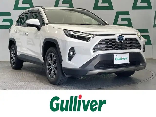 トヨタ ＲＡＶ４ ハイブリッドG 鹿児島県 2022(令4)年 4.3万km ホワイトパールクリスタルシャイン 禁煙車　/純正ナビ/(フルセグTV/Bluetooth/CD/DVD)/トヨタセーフティセンス/　・衝突軽減ブレーキ/　・レーンキープアシスト/　・追従型クルーズコントロール/デジタルインナーミラー/バックカメラ/シートメモリー付きパワーシート/前席シートヒーター/前席シートベンチレーション/置くだけ充電/ステアリングリモコン/ステアリングヒーター/ブラインドスポットモニター/前後ドライブレコーダー/ハンズフリーパワーバックドア/オートマチックハイビーム/LEDヘッドライト/4WD/純正ドアバイザー