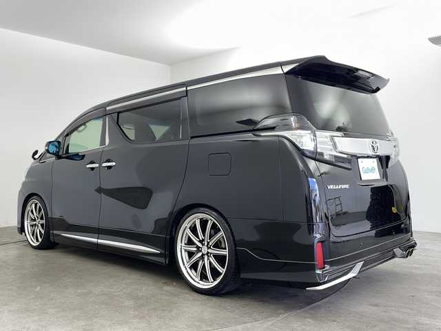トヨタ ヴェルファイア Z Gエディション 兵庫県 2015(平27)年 6.7万km ブラック ・ALPINE10インチナビ&Bluetooth&DVD&CD&TV&SD/・バックカメラ/・ETC/・ALPINEリアフリップダウンモニター/・ステアリングスイッチ/・ステアリングヒーター/・クルーズコントロール/・電動パーキングブレーキ/・両側パワースライドドア/・レザーシート/・パワーシート/・モデリスタエアロ/・オットマン/・サンルーフ/・LEDヘッドライト/・オートライト/・横滑り防止装置/・盗難防止装置/・衝突被害軽減システム/・コーナーセンサー/・社外21インチアルミホイール/・純正フロアマット/・メモリシート（D席）/・カーテンエアバッグ/・Wエアバッグ/・プッシュスタートボタン/・アイドリングストップ/・ローダウン/・スマートキー