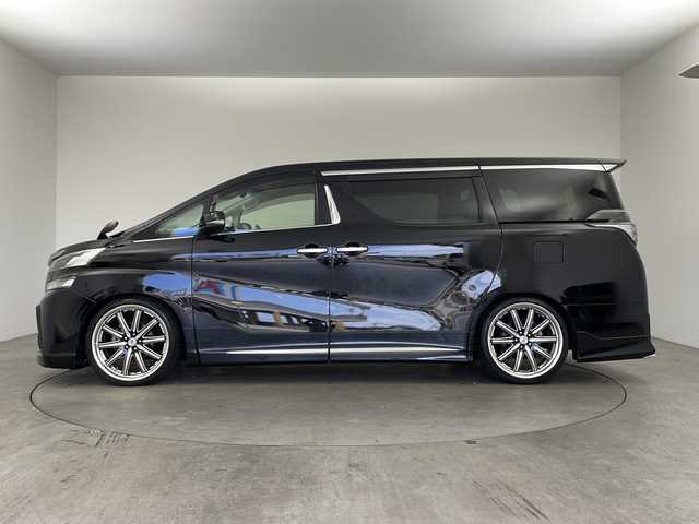 トヨタ ヴェルファイア Z Gエディション 兵庫県 2015(平27)年 6.7万km ブラック ・ALPINE10インチナビ&Bluetooth&DVD&CD&TV&SD/・バックカメラ/・ETC/・ALPINEリアフリップダウンモニター/・ステアリングスイッチ/・ステアリングヒーター/・クルーズコントロール/・電動パーキングブレーキ/・両側パワースライドドア/・レザーシート/・パワーシート/・モデリスタエアロ/・オットマン/・サンルーフ/・LEDヘッドライト/・オートライト/・横滑り防止装置/・盗難防止装置/・衝突被害軽減システム/・コーナーセンサー/・社外21インチアルミホイール/・純正フロアマット/・メモリシート（D席）/・カーテンエアバッグ/・Wエアバッグ/・プッシュスタートボタン/・アイドリングストップ/・ローダウン/・スマートキー