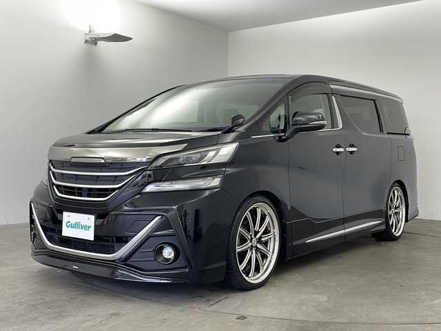 トヨタ ヴェルファイア Z Gエディション 兵庫県 2015(平27)年 6.7万km ブラック ・ALPINE10インチナビ&Bluetooth&DVD&CD&TV&SD/・バックカメラ/・ETC/・ALPINEリアフリップダウンモニター/・ステアリングスイッチ/・ステアリングヒーター/・クルーズコントロール/・電動パーキングブレーキ/・両側パワースライドドア/・レザーシート/・パワーシート/・モデリスタエアロ/・オットマン/・サンルーフ/・LEDヘッドライト/・オートライト/・横滑り防止装置/・盗難防止装置/・衝突被害軽減システム/・コーナーセンサー/・社外21インチアルミホイール/・純正フロアマット/・メモリシート（D席）/・カーテンエアバッグ/・Wエアバッグ/・プッシュスタートボタン/・アイドリングストップ/・ローダウン/・スマートキー
