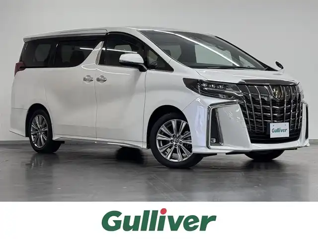 トヨタ アルファード S タイプゴールドⅡ 三重県 2022(令4)年 2.5万km ホワイトパールクリスタルシャイン ガソリン/FF/MTモード付インパネCVT/純正 9インチディスプレイオーディオ（ナビ搭載）/（AM/FM/USB/iPod/Bluetooth/TV*/Miracast/AppleCarPlay/AndroidAuto）*…OP/12.1インチ 後席モニター V12T-R68C（純正）/バックガイドモニター/両側パワースライドドア/ドライブレコーダー 前後/ETC2.0/Toyota Safety Sense/●プリクラッシュセーフティ/●レーントレーシングアシスト/●レーダークルコン/●ロードサインアシスト/●アダプティブハイビームシステム/・先行車発進告知機能/・クリアランスソナー/・パーキングサポートブレーキ（前後静止物）/・など/装備/3眼LEDヘッドランプ（専用加飾）/・ハーフレザーシート/・左右＆後席独立オートエアコン/・パワーバックドア/・オットマンシート（2nd）/・AC100Vコンセント（100W）/・ステアリングスイッチ/・電子パーキングブレーキ＆ブレーキホールド/・オートライト/・純正18inAW/・保/取/ナビ取/・スマートキーx2/など