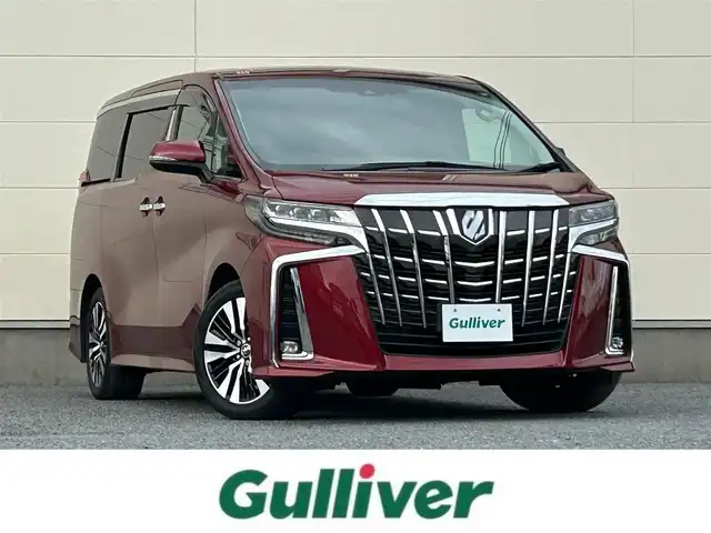 トヨタ アルファード S Cパッケージ 茨城県 2020(令2)年 10.8万km ダークレッドマイカメタリック 純正ディスプレイオーディオ【ナビ機能付】/(FM/AM/TV/Bluetooth/Miracast)/フリップダウンモニター/パノラミックビューモニター/トヨタセーフティセンス/・衝突軽減ブレーキ/・レーンキープアシスト/・レーダークルーズコントロール/・オートマチックハイビーム/・クリアランスソナー/・ブラインドスポットモニター/JBLオーディオ/ETC2.0/快適温熱シート/オットマン/パワーシート/ドライブレコーダー（前後）/ステアリングヒーター/パワーバックドア/リアサンシェード/純正アルミホイール