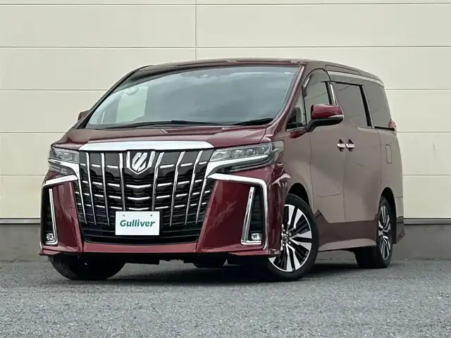 トヨタ アルファード S Cパッケージ 茨城県 2020(令2)年 10.8万km ダークレッドマイカメタリック 純正ディスプレイオーディオ【ナビ機能付】/(FM/AM/TV/Bluetooth/Miracast)/フリップダウンモニター/パノラミックビューモニター/トヨタセーフティセンス/・衝突軽減ブレーキ/・レーンキープアシスト/・レーダークルーズコントロール/・オートマチックハイビーム/・クリアランスソナー/・ブラインドスポットモニター/JBLオーディオ/ETC2.0/快適温熱シート/オットマン/パワーシート/ドライブレコーダー（前後）/ステアリングヒーター/パワーバックドア/リアサンシェード/純正アルミホイール