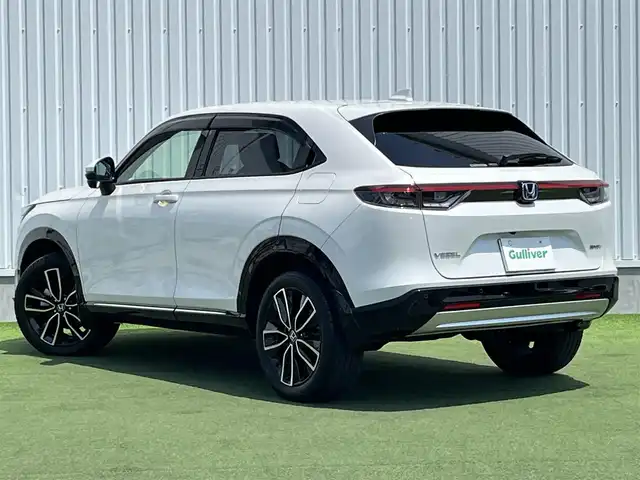 ホンダ ヴェゼル ハイブリッド e:HEV Z 香川県 2022(令4)年 2.1万km プラチナホワイトパール Honda SENSING/純正9インチワイドディスプレイナビ/　AM FM Bluetooth AppleCarPlay AndroidAuto/フルセグTV/ビルトインETC2.0/レーダークルーズコントロール/全方位カメラ/ドライブレコーダー/置くだけ充電/BSM/LEDオートヘッドライト/シーケンシャルターンランプ/デジタルインナーミラー/ハーフレザーシート/シートヒーター(前席)/パワーバックドア/純正18インチアルミホイール/スマートキー2本/ワンオーナー