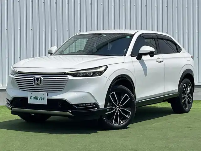 ホンダ ヴェゼル ハイブリッド e:HEV Z 香川県 2022(令4)年 2.1万km プラチナホワイトパール Honda SENSING/純正9インチワイドディスプレイナビ/　AM FM Bluetooth AppleCarPlay AndroidAuto/フルセグTV/ビルトインETC2.0/レーダークルーズコントロール/全方位カメラ/ドライブレコーダー/置くだけ充電/BSM/LEDオートヘッドライト/シーケンシャルターンランプ/デジタルインナーミラー/ハーフレザーシート/シートヒーター(前席)/パワーバックドア/純正18インチアルミホイール/スマートキー2本/ワンオーナー