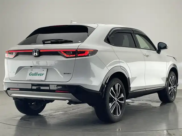 ホンダ ヴェゼル ハイブリッド e:HEV Z 愛知県 2022(令4)年 2.1万km プラチナホワイトパール Honda SENSING/純正9インチワイドディスプレイナビ/　AM FM Bluetooth AppleCarPlay AndroidAuto/フルセグTV/ビルトインETC2.0/レーダークルーズコントロール/全方位カメラ/ドライブレコーダー/置くだけ充電/BSM/LEDオートヘッドライト/シーケンシャルターンランプ/デジタルインナーミラー/ハーフレザーシート/シートヒーター(前席)/パワーバックドア/純正18インチアルミホイール/スマートキー2本/ワンオーナー