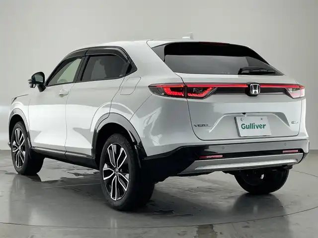 ホンダ ヴェゼル ハイブリッド e:HEV Z 愛知県 2022(令4)年 2.1万km プラチナホワイトパール Honda SENSING/純正9インチワイドディスプレイナビ/　AM FM Bluetooth AppleCarPlay AndroidAuto/フルセグTV/ビルトインETC2.0/レーダークルーズコントロール/全方位カメラ/ドライブレコーダー/置くだけ充電/BSM/LEDオートヘッドライト/シーケンシャルターンランプ/デジタルインナーミラー/ハーフレザーシート/シートヒーター(前席)/パワーバックドア/純正18インチアルミホイール/スマートキー2本/ワンオーナー