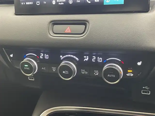 ホンダ ヴェゼル ハイブリッド e:HEV Z 愛知県 2022(令4)年 2.1万km プラチナホワイトパール Honda SENSING/純正9インチワイドディスプレイナビ/　AM FM Bluetooth AppleCarPlay AndroidAuto/フルセグTV/ビルトインETC2.0/レーダークルーズコントロール/全方位カメラ/ドライブレコーダー/置くだけ充電/BSM/LEDオートヘッドライト/シーケンシャルターンランプ/デジタルインナーミラー/ハーフレザーシート/シートヒーター(前席)/パワーバックドア/純正18インチアルミホイール/スマートキー2本/ワンオーナー